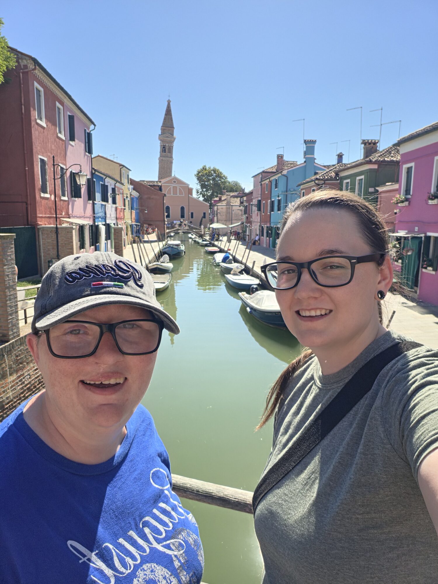 Shiloh and Jordyn beside a colorful canal in Burano