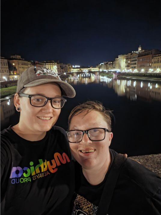 Shiloh and Jordyn beside the Arno River at night