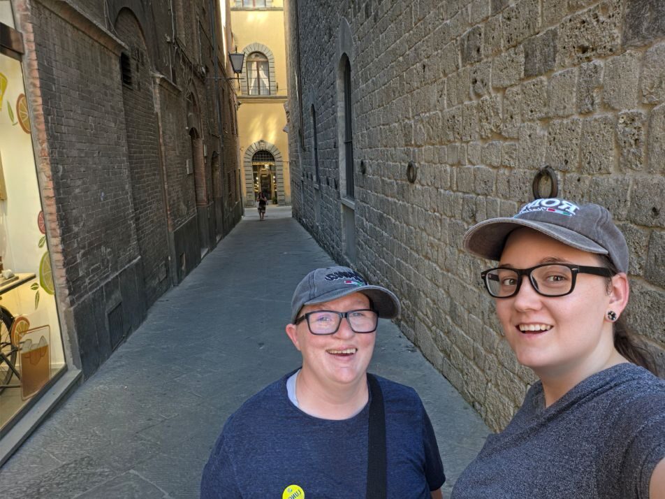 Shiloh and Jordyn on a narrow street in Siena