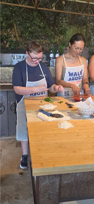 Shiloh working with pizza dough during the class