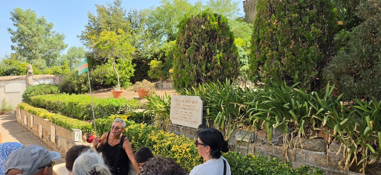 Guide speaking outside the Roman catacombs