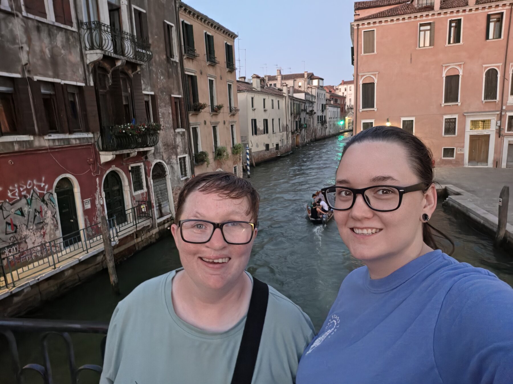 Shiloh and Jordyn beside a canal in the evening
