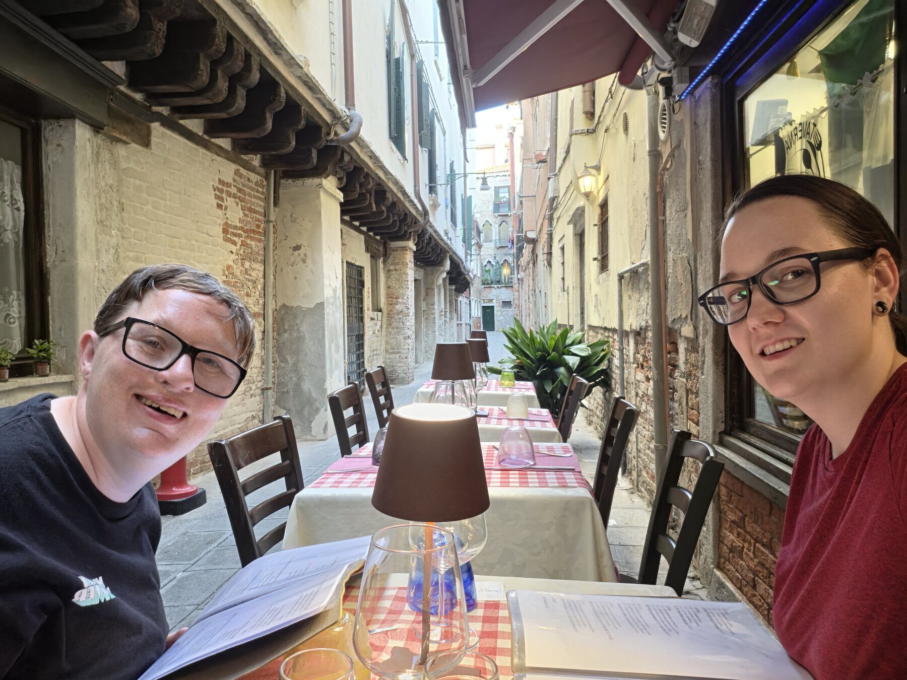 Shiloh and Jordyn seated outside at Osteria Barababao